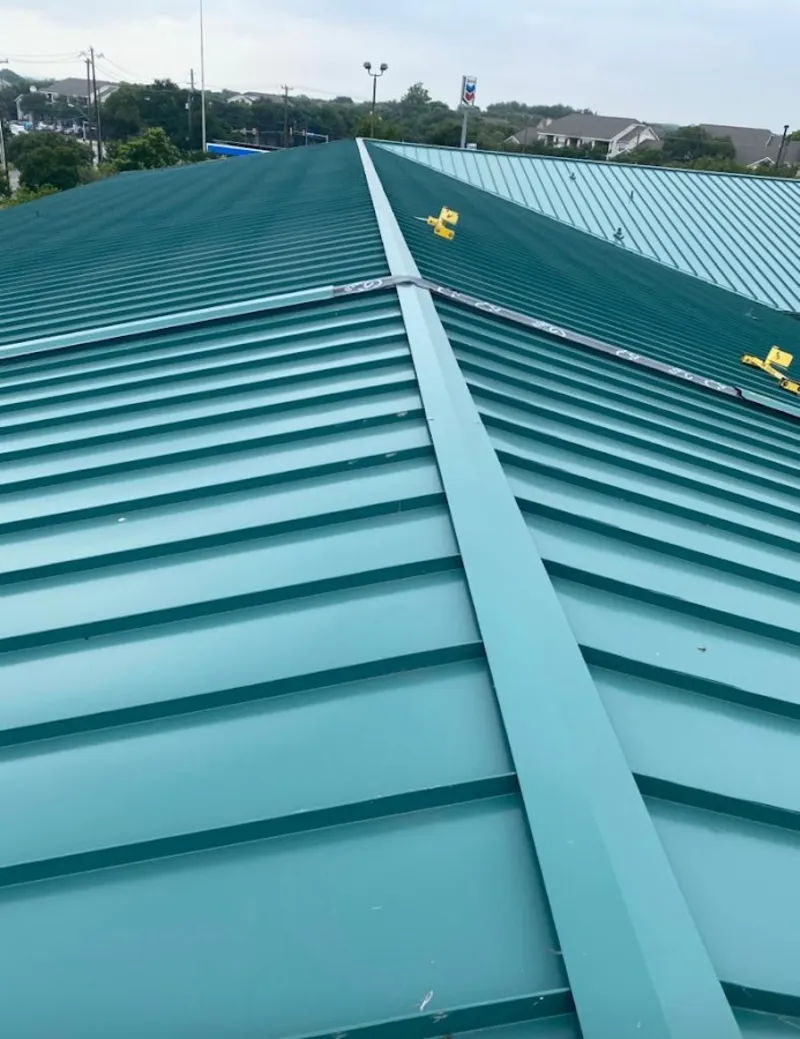 Green commercial metal roof ridge and valley for Metal Roof Repair in Tiverton
